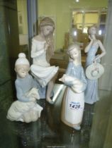 Four figures including three Lladro; Girl with Piglet,