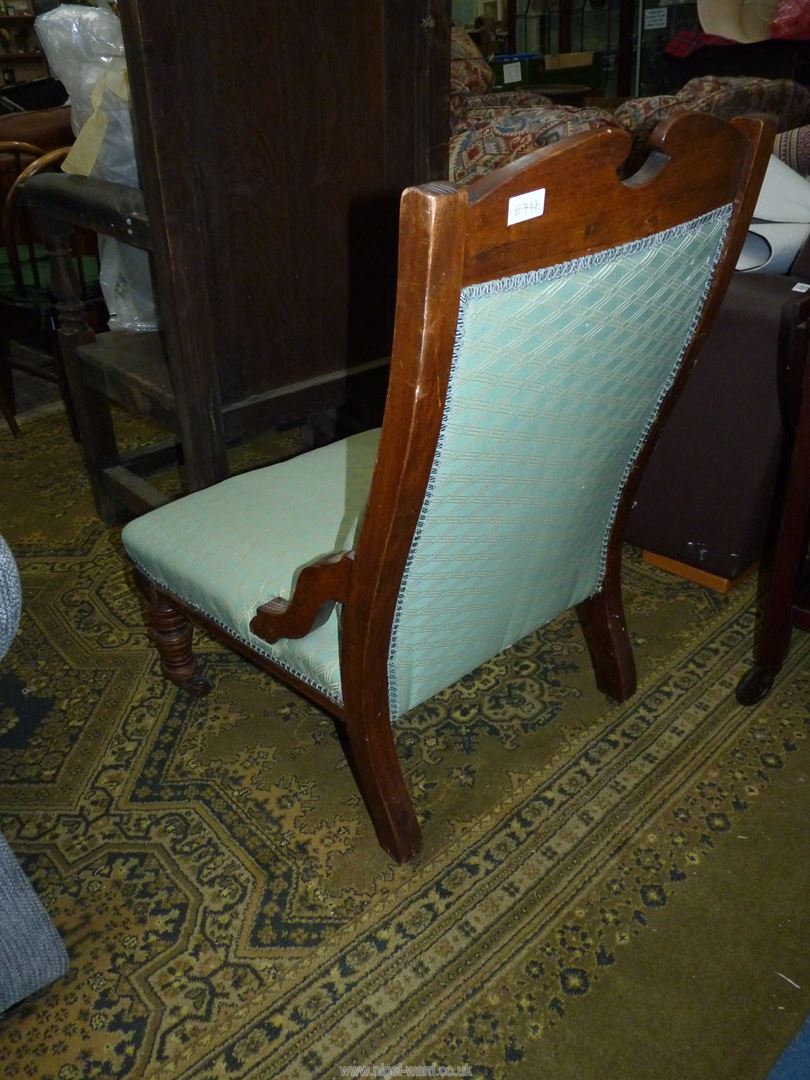 A Mahogany framed lady's Fireside Chair standing on turned front legs and upholstered in lattice - Image 2 of 4