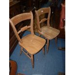 A set of four bar back Kitchen Chairs standing on turned legs.