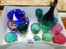A box of glass including nine green glasses, two cranberry,