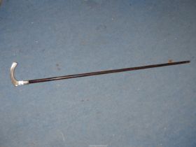 A walking Cane having German silver handle marked 830, initials engraved at the end of the handle.