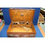 A gentleman's Leather Suitcase with silver topped jars (one jar missing but lid present),