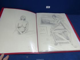 A red portfolio containing Pencil, Charcoal and water colour Studies of female and male nudes.