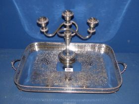 A plated candelabra and large plated galleried tray.