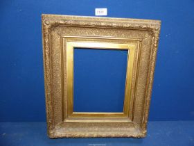 An antique giltwood frame.