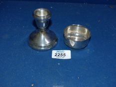 A small weighted silver candlestick and a silver bowl, both stamped Birmingham.