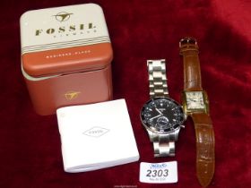 A boxed gents Fossil wristwatch and a Skems wristwatch with leather strap.