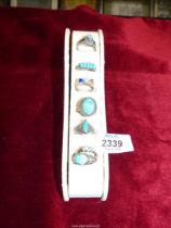 A small quantity of 925 dress Rings, all with blue centres, some being semi-precious,