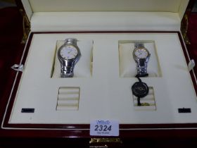 An Aston Gerald stainless steel His & Hers two piece watch set in presentation box, as new.