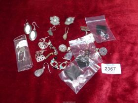 A quantity of 925 dropper Earrings including marcasite, floral, etc. and a pair with 9ct backs.