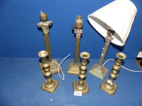 Three small Victorian brass candlesticks, diamond sided,