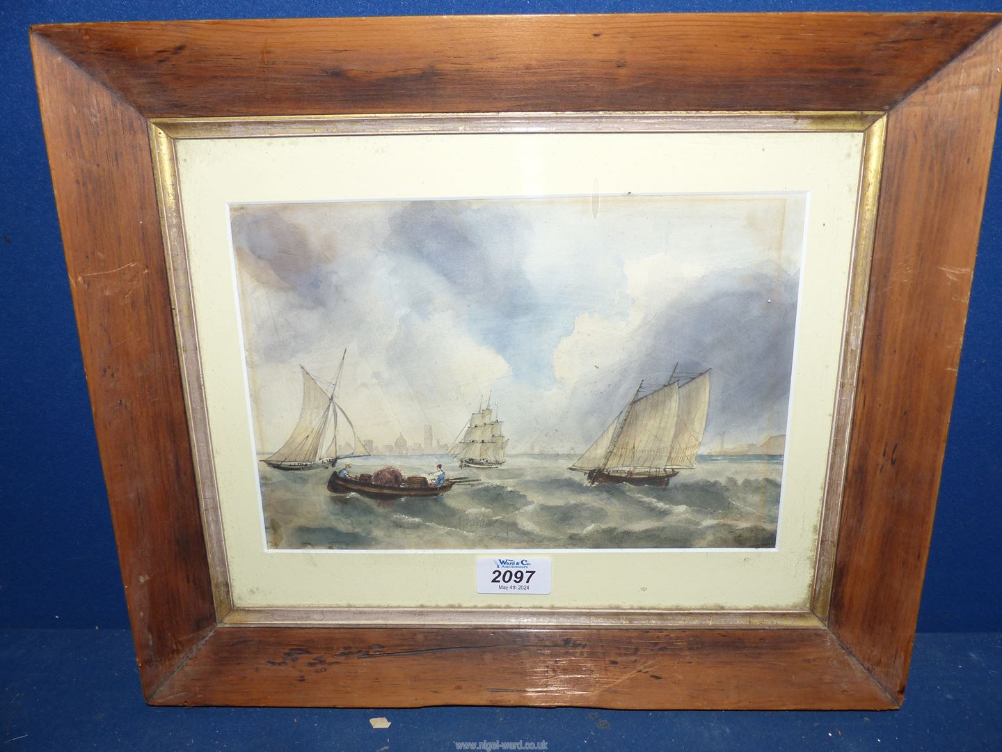A wooden framed Watercolour depicting sailing ships and masted ships, no visible signature,