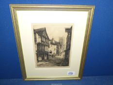 A framed and mounted etching of Dartmouth. Signed lower right W.