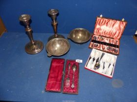 A small box of silver plate cutlery including teaspoons, pair of candlesticks etc.