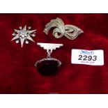 Three costume brooches including;