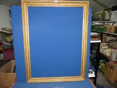 A large ornate gilt Picture Frame, 31'' x 40 1/4'' overall, aperture size 27'' x 35 3/4''. ***V.A.