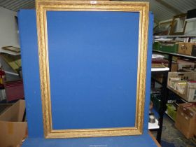 A large ornate gilt Picture Frame, 31'' x 40 1/4'' overall, aperture size 27'' x 35 3/4''. ***V.A.
