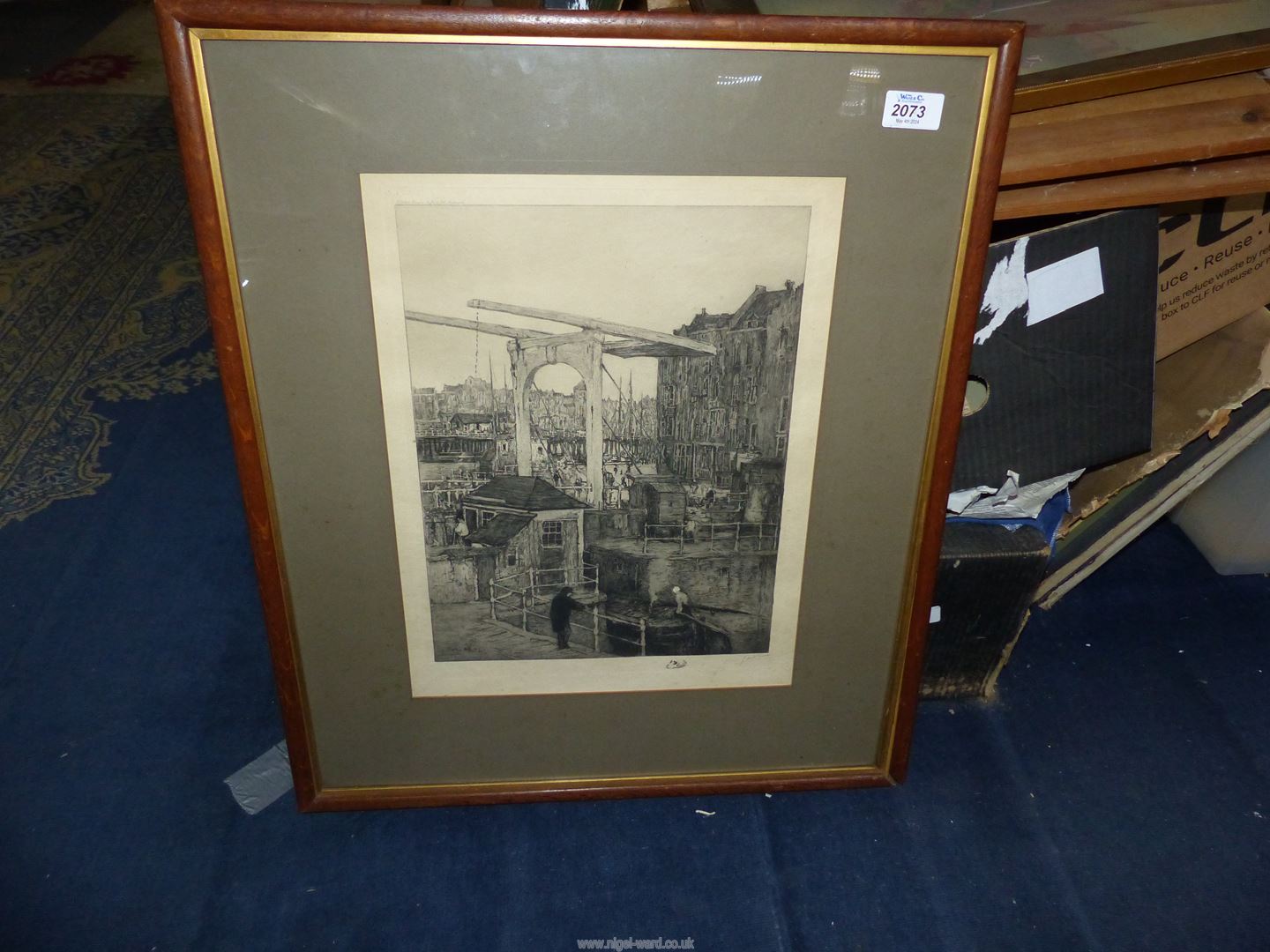 A large Lithograph Print depicting a canal scene in Amsterdam, signed M.