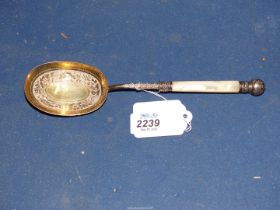 A Victorian silver gilt spoon having Mother of pearl handle, possibly an anointing spoon,