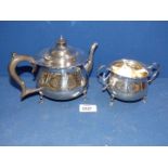 A Silver Teapot having wooden handle and finial, London 1923,