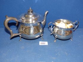 A Silver Teapot having wooden handle and finial, London 1923,