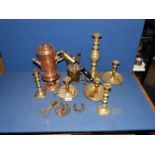 An antique brass blow torch, a copper coffee pot and burner, brass candlesticks with pushers, etc.