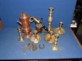 An antique brass blow torch, a copper coffee pot and burner, brass candlesticks with pushers, etc.