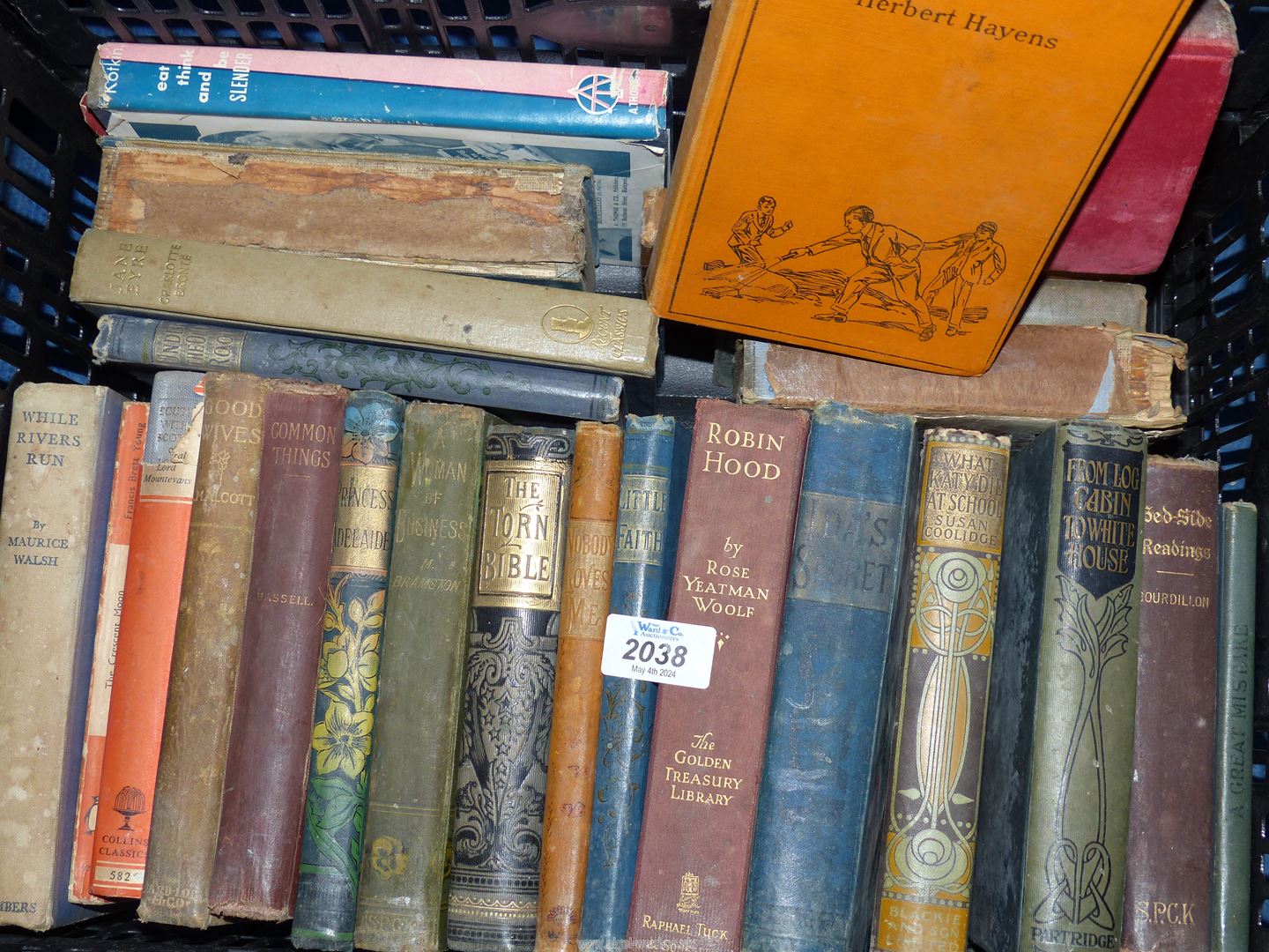 A crate of books, Tom Brown's School Days, Jane Eyre, Little Faith, The Heart-shaped Ruby etc.