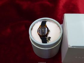 A ladies Radley boxed 'Watch it ladies' wristwatch with black dial and silicone strap, as new.