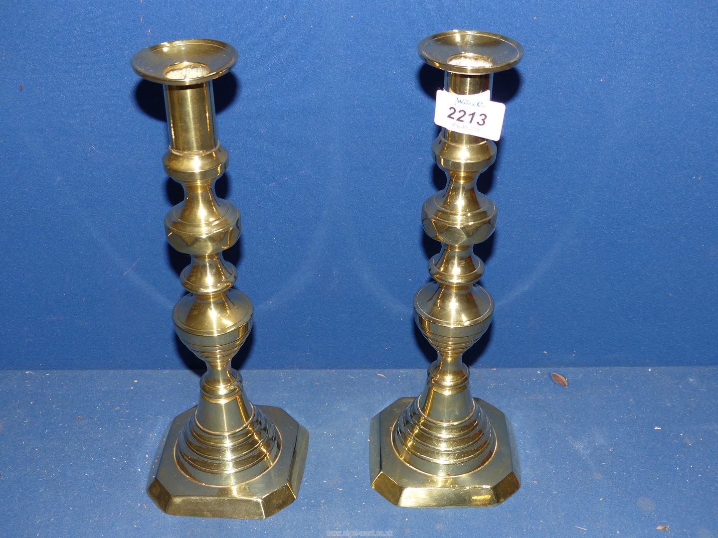 A pair of brass Candlesticks, 11 3/4'' tall.