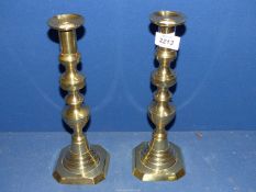 A pair of brass Candlesticks, 11 3/4'' tall.