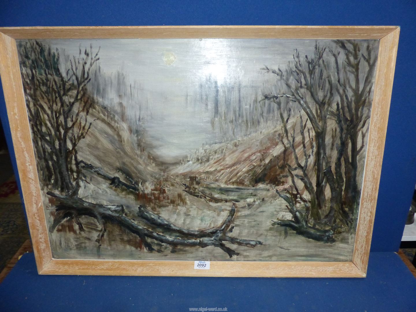 A framed Oil on board depicting trees and tree trunks, 31" x 22 1/4".