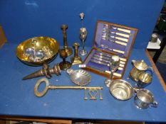 A quantity of brass and plated ware including large key, candlesticks, bud vases, fish eaters, etc.
