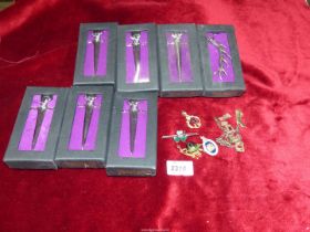 A quantity of boxed Heritage Highland Clothing costume jewellery, unmarked charm bracelet, etc.