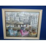 A framed watercolour of a Fishing Town with Three boats moored in the Harbour, no visible signature,