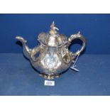 An ornate Victorian silver Teapot with bird of prey finial on a hexagonal lobed body,