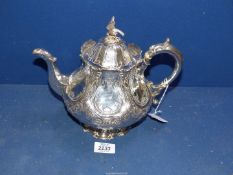 An ornate Victorian silver Teapot with bird of prey finial on a hexagonal lobed body,