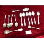Six Silver Birmingham teaspoons JS & J hallmark, together with a small berry spoon,