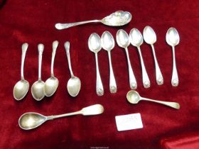 Six Silver Birmingham teaspoons JS & J hallmark, together with a small berry spoon,