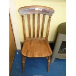 A lath-back solid seated traditional kitchen chair.