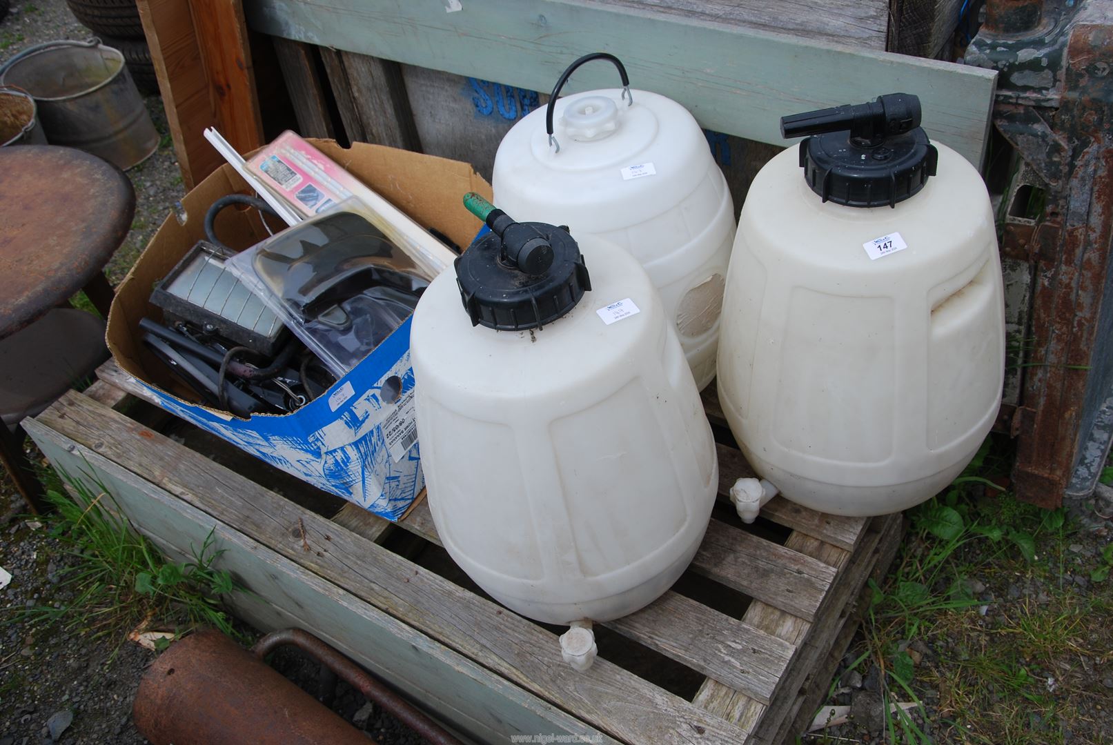 Three water containers and box of miscellaneous.