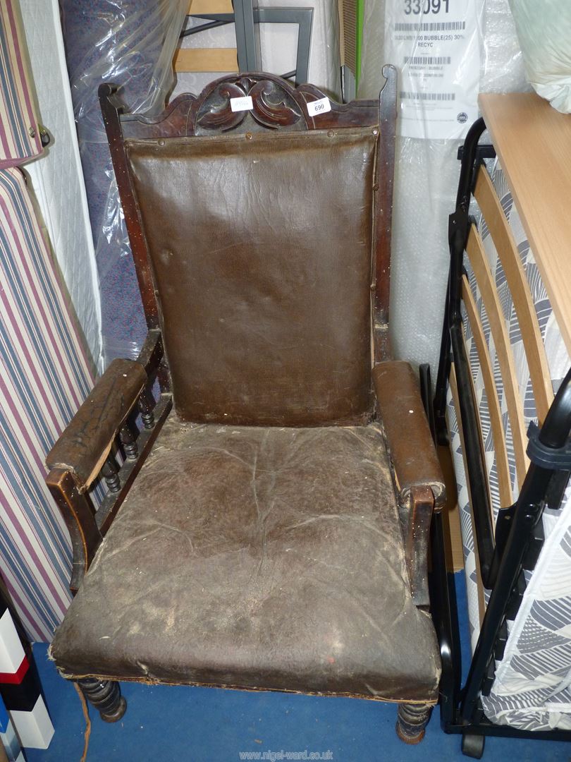 A vintage Rexine upholstered Armchair.