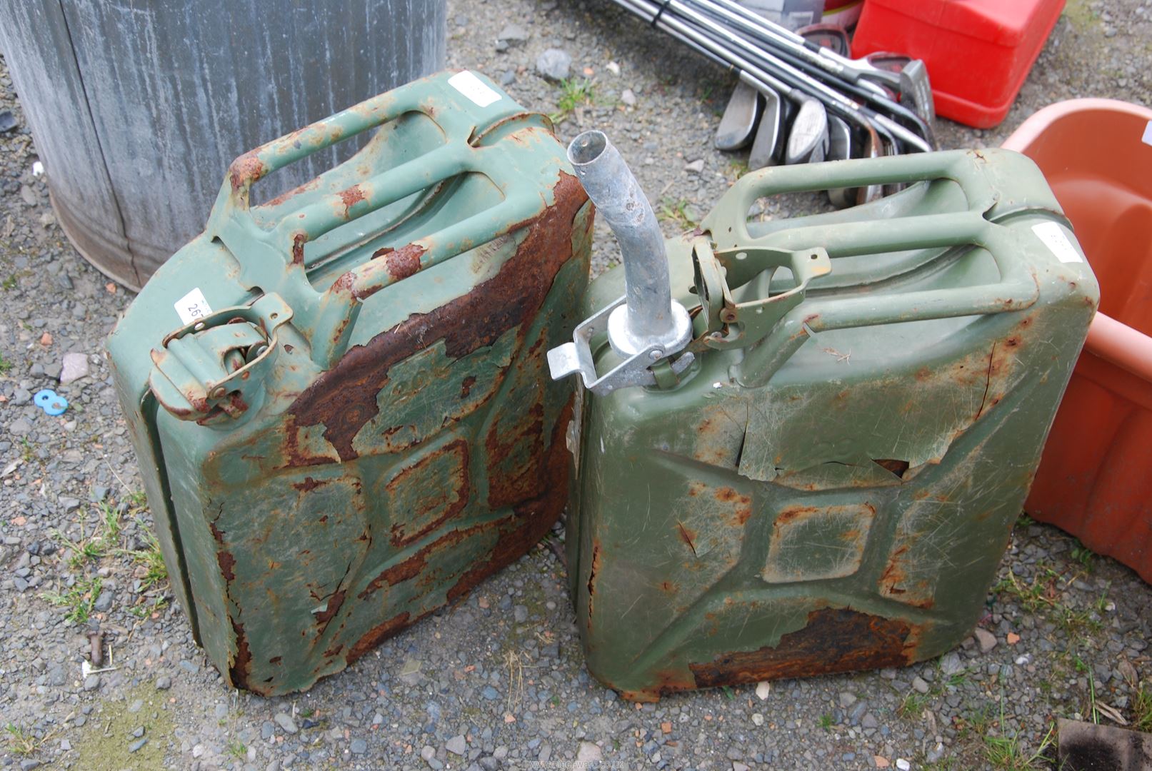 Two Jerry cans, one with spout.
