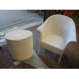 A wicker chair and a wicker laundry basket.