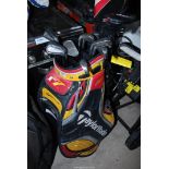 A "Taylormade" Golf bag and clubs.