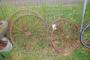 Four vintage steel spoke Carriage wheels.