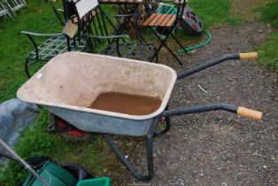 A galvanized contractor's wheelbarrow with pneumatic tyre.