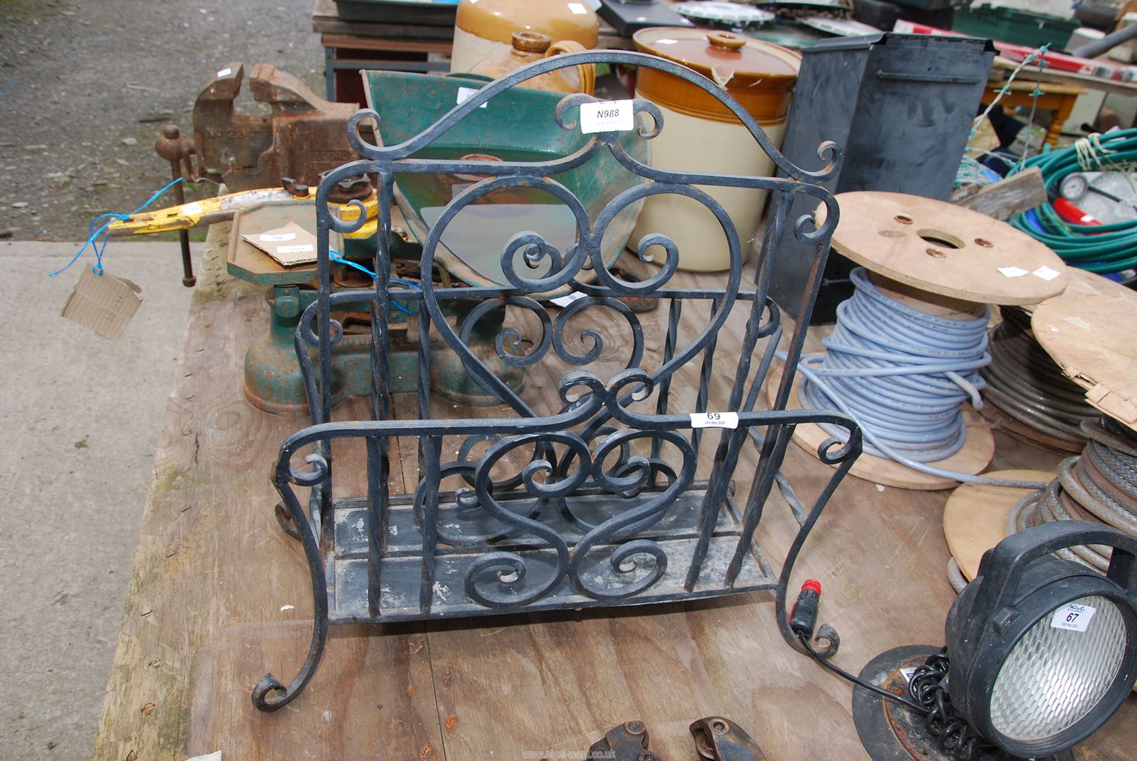 A wrought iron magazine rack.