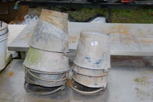 A quantity of galvanized buckets.