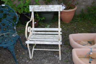 A White painted metal garden chair, 21 1/2" wide x 30" high.